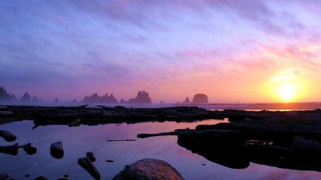 Sunset rocky beach water stacks free wallpaper for desktop - medium preview image