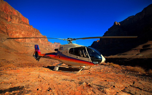 Helicopter rocky mountains canyon sunset free wallpaper for desktop - medium preview image