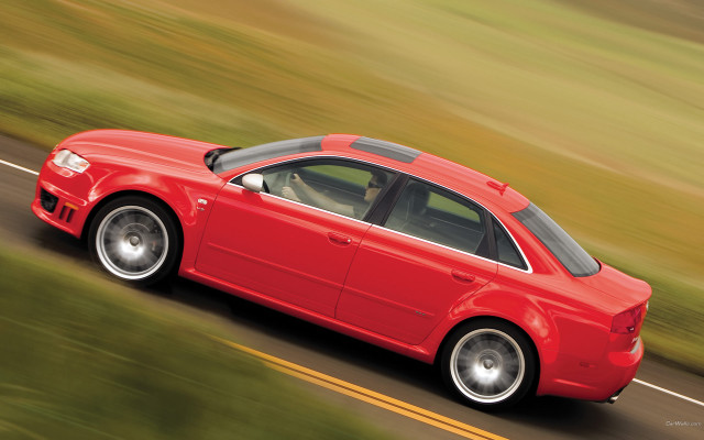 Red car driving road grass free wallpaper for desktop - medium preview image