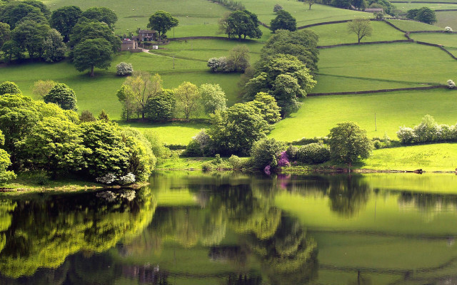 Lush green hills lake house free wallpaper for desktop - medium preview image