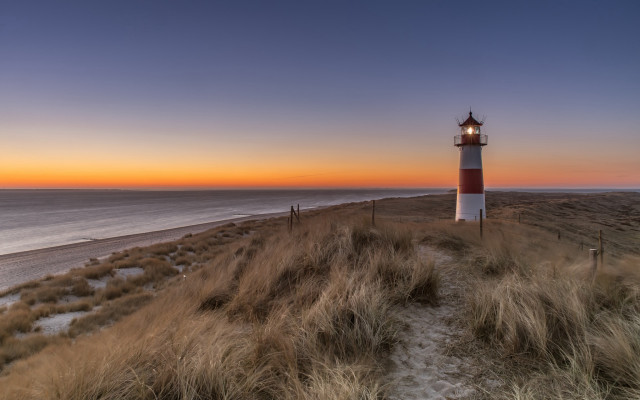 Lighthouse grassy hill ocean sunset #2 free wallpaper for desktop - medium preview image