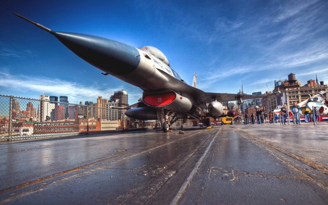Jet fighter wet runway cityscape free wallpaper for desktop - medium preview image