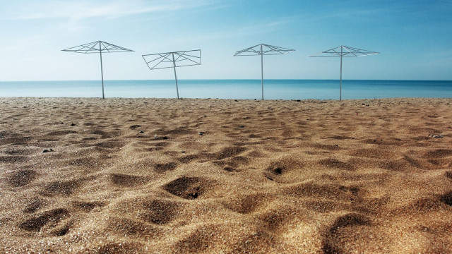 Beach umbrellas ocean sky land free wallpaper for desktop - medium preview image