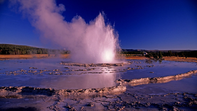 Geyser trees blue sky dusk free wallpaper for desktop - medium preview image