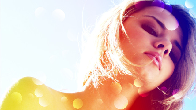 Woman blowing hair bokeh sunlight free wallpaper for desktop - medium preview image