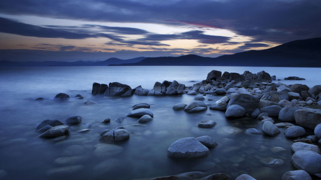 Rocky beach mountains cloudy sky free wallpaper for desktop - medium preview image