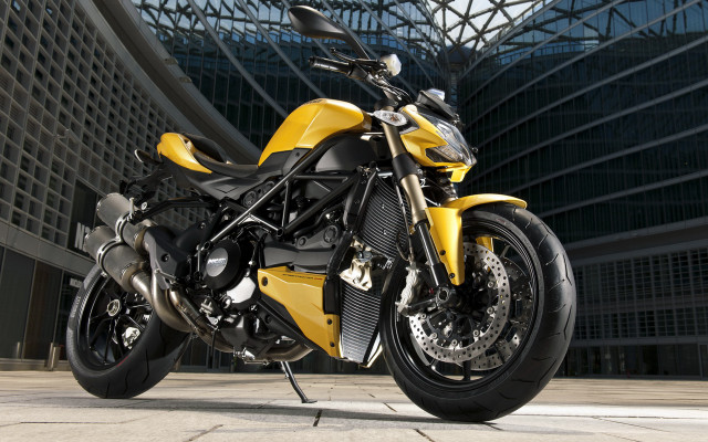 Yellow motorcycle building sky glass free wallpaper for desktop - medium preview image