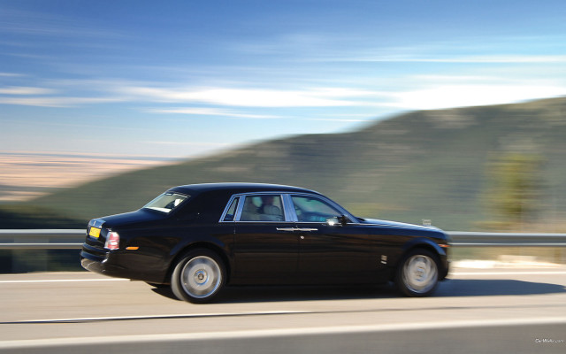 Black car mountain road luxury free wallpaper for desktop - medium preview image