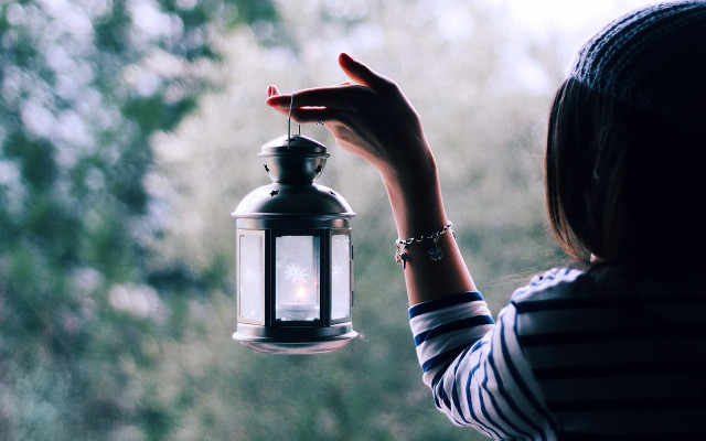 Woman holding lantern outside window free wallpaper for desktop - medium preview image