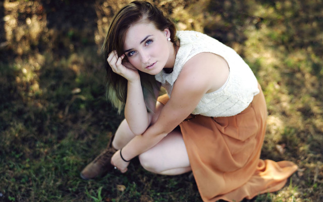 Woman kneeling grass tree portrait free wallpaper for desktop - medium preview image