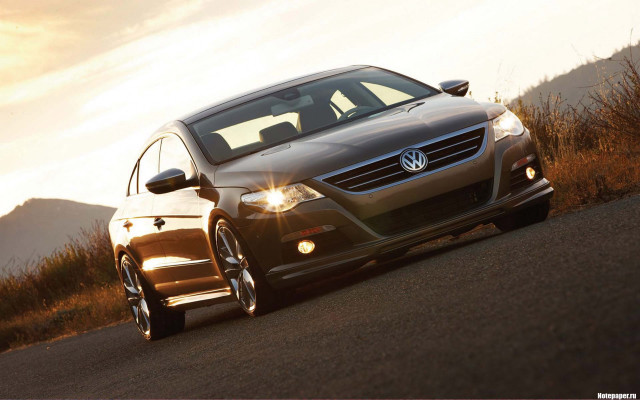 Car shining sunfront lights photorealism free wallpaper for desktop - medium preview image