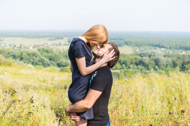 Romantic couple kissing field nature free wallpaper for desktop - medium preview image