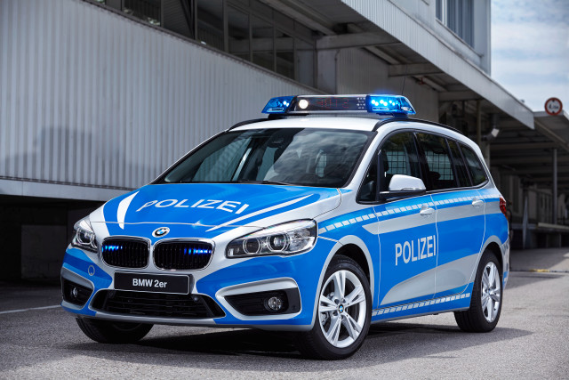 Police car building sky white free wallpaper for desktop - medium preview image