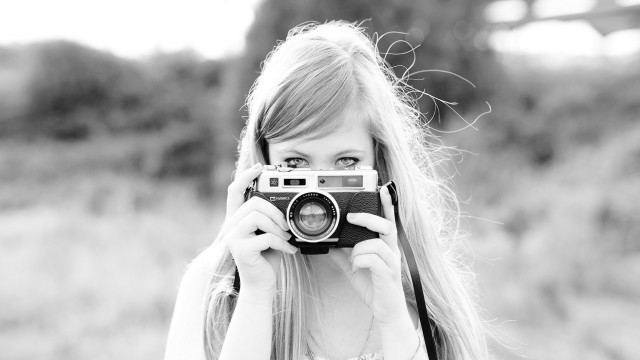 Woman smiling camera wind blackwhite free wallpaper for desktop - medium preview image