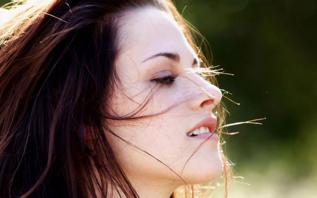 Woman blowing hair closed eyes free wallpaper for desktop - medium preview image