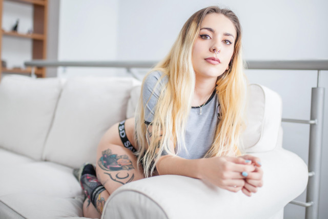 Woman couch tattoo blonde posing free wallpaper for desktop - medium preview image