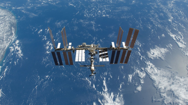Space station ocean earth plane free wallpaper for desktop - medium preview image
