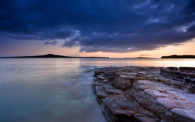 Rocky shore island cloudy sky free wallpaper for desktop - medium preview image