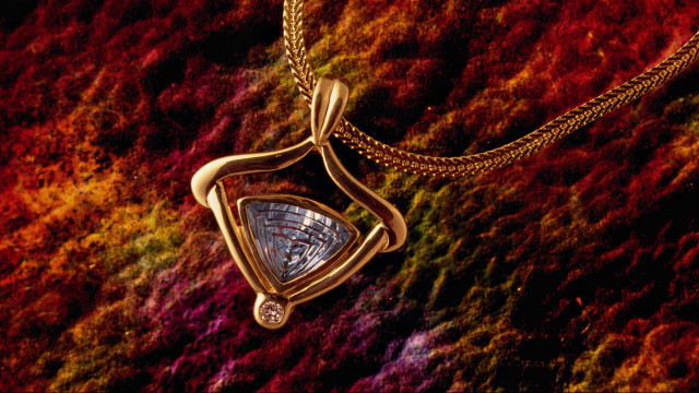 Gold necklace triangular pendant colorful free wallpaper for desktop - medium preview image