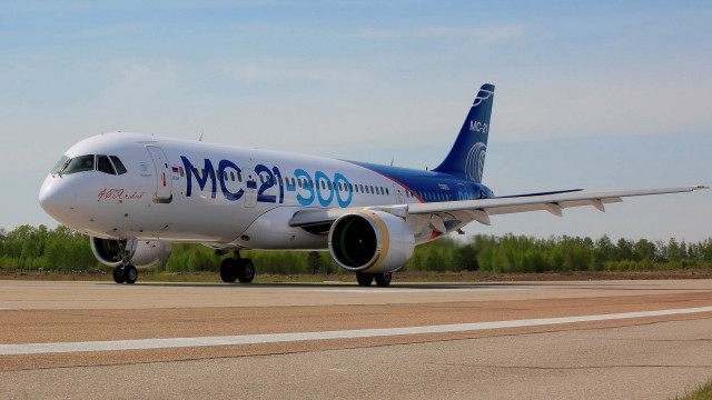 Jetliner runway forest sunny day free wallpaper for desktop - medium preview image