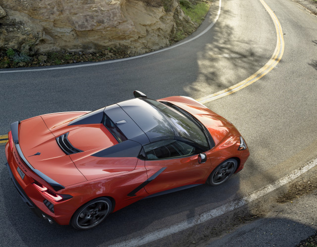 Red sports car cliff side free wallpaper for desktop - medium preview image