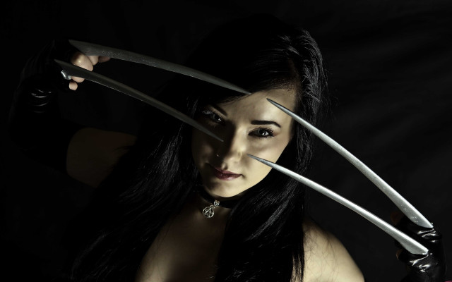 Woman holding two knives overhead free wallpaper for desktop - medium preview image