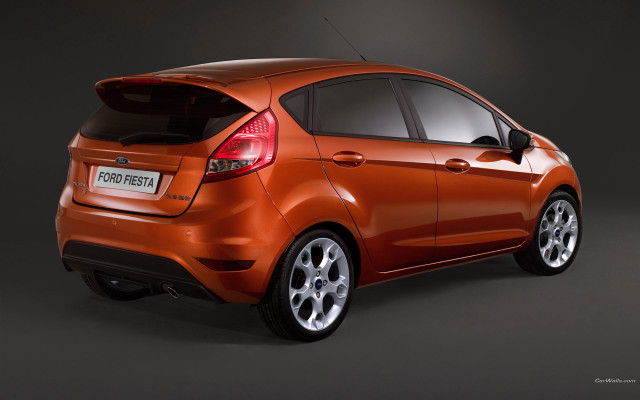 Small orange car studio rendering free wallpaper for desktop - medium preview image