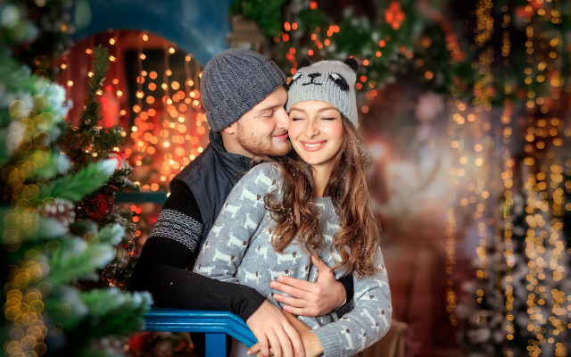 Christmas hug couple blurry bokeh free wallpaper for desktop - medium preview image