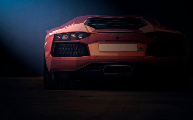 Red sports car dark spotlights free wallpaper for desktop - medium preview image