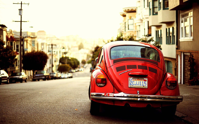 Red car road building street free wallpaper for desktop - medium preview image