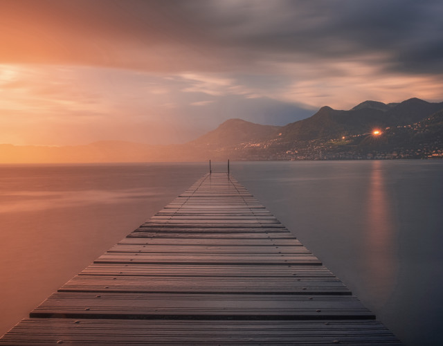 Docked mountains sunset reflection city free wallpaper for desktop - medium preview image