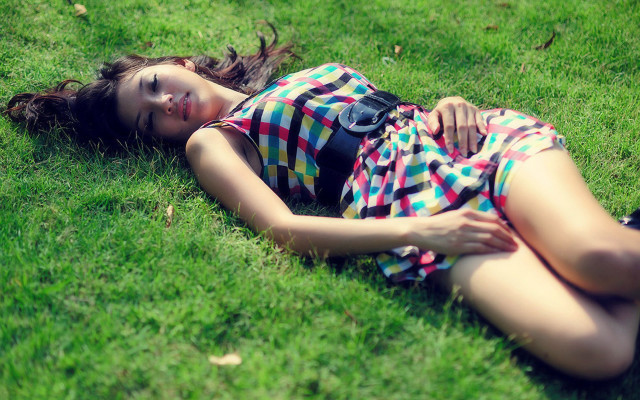 Woman laying on grass nature free wallpaper for desktop - medium preview image