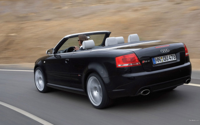 Black convertible car road hillside free wallpaper for desktop - medium preview image