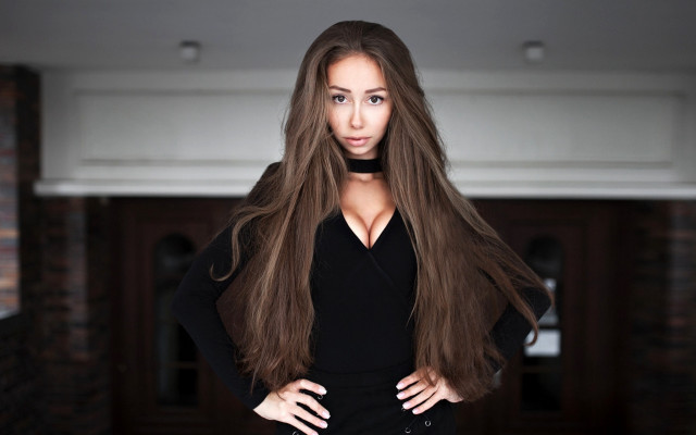 Woman longhair brickwall blackdress portrait free wallpaper for desktop - medium preview image