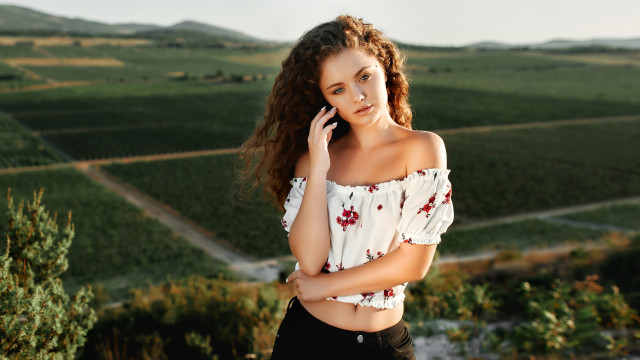 Woman long hair cellphone field free wallpaper for desktop - medium preview image