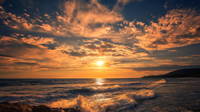 Sunset ocean wave rock person #2 free wallpaper for desktop - medium preview image