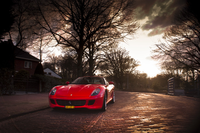 Red sports car cobblestone street #2 free wallpaper for desktop - medium preview image