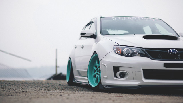 White car green rim road free wallpaper for desktop - medium preview image