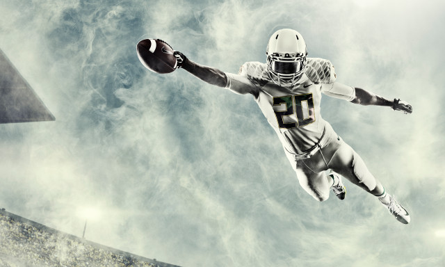 Football player in air stadium free wallpaper for desktop - medium preview image