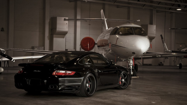 Black car jet hangar luxury free wallpaper for desktop - medium preview image