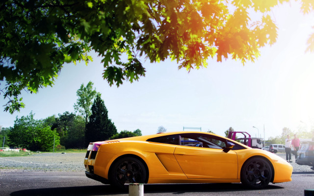 Yellow sports car parking lot free wallpaper for desktop - medium preview image