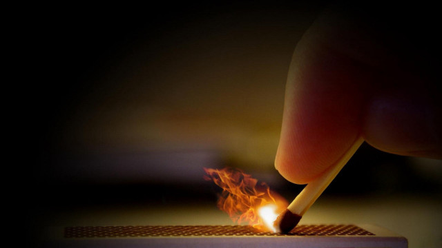 Person lighting match sparks fire free wallpaper for desktop - medium preview image