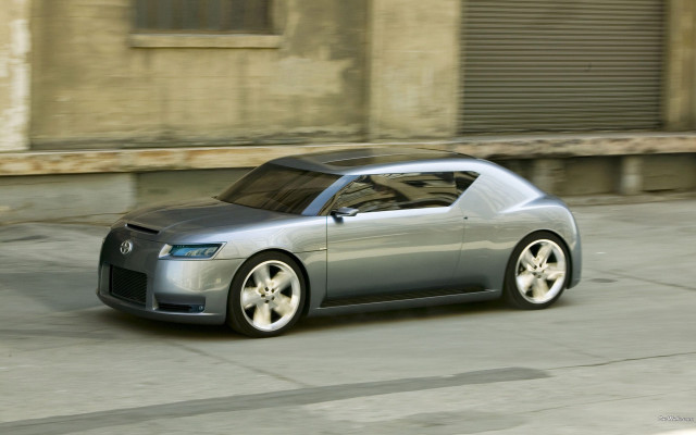 Silver car driving building garage free wallpaper for desktop - medium preview image