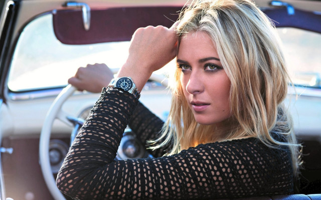 Woman sitting car blonde blurry free wallpaper for desktop - medium preview image