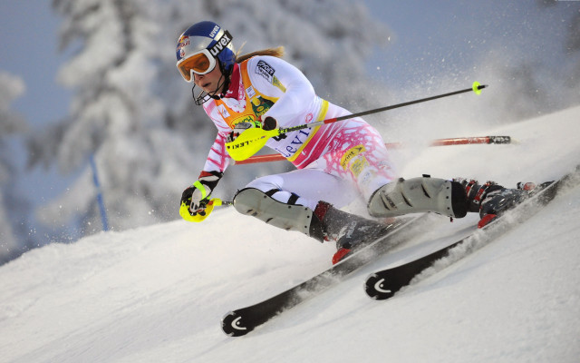 Woman yellow ski suit skiing free wallpaper for desktop - medium preview image