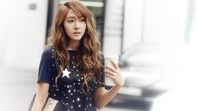 Woman holding coffee cell phone #2 free wallpaper for desktop - medium preview image