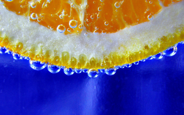 Orange slice water droplets blue free wallpaper for desktop - medium preview image