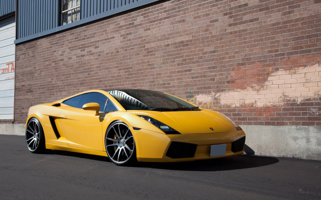 Yellow sports car brick building free wallpaper for desktop - medium preview image