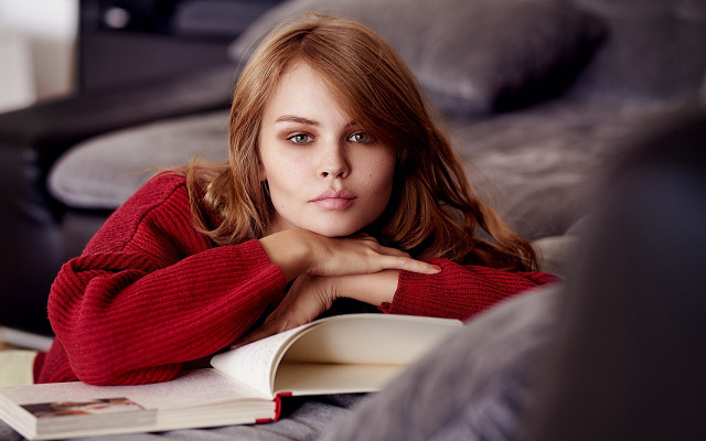 Woman couch book serious portrait free wallpaper for desktop - medium preview image