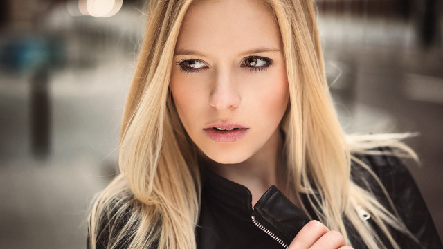 Blonde woman black jacket bokeh free wallpaper for desktop - medium preview image